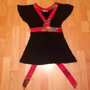 Flowy black shirt with red lining that ties.